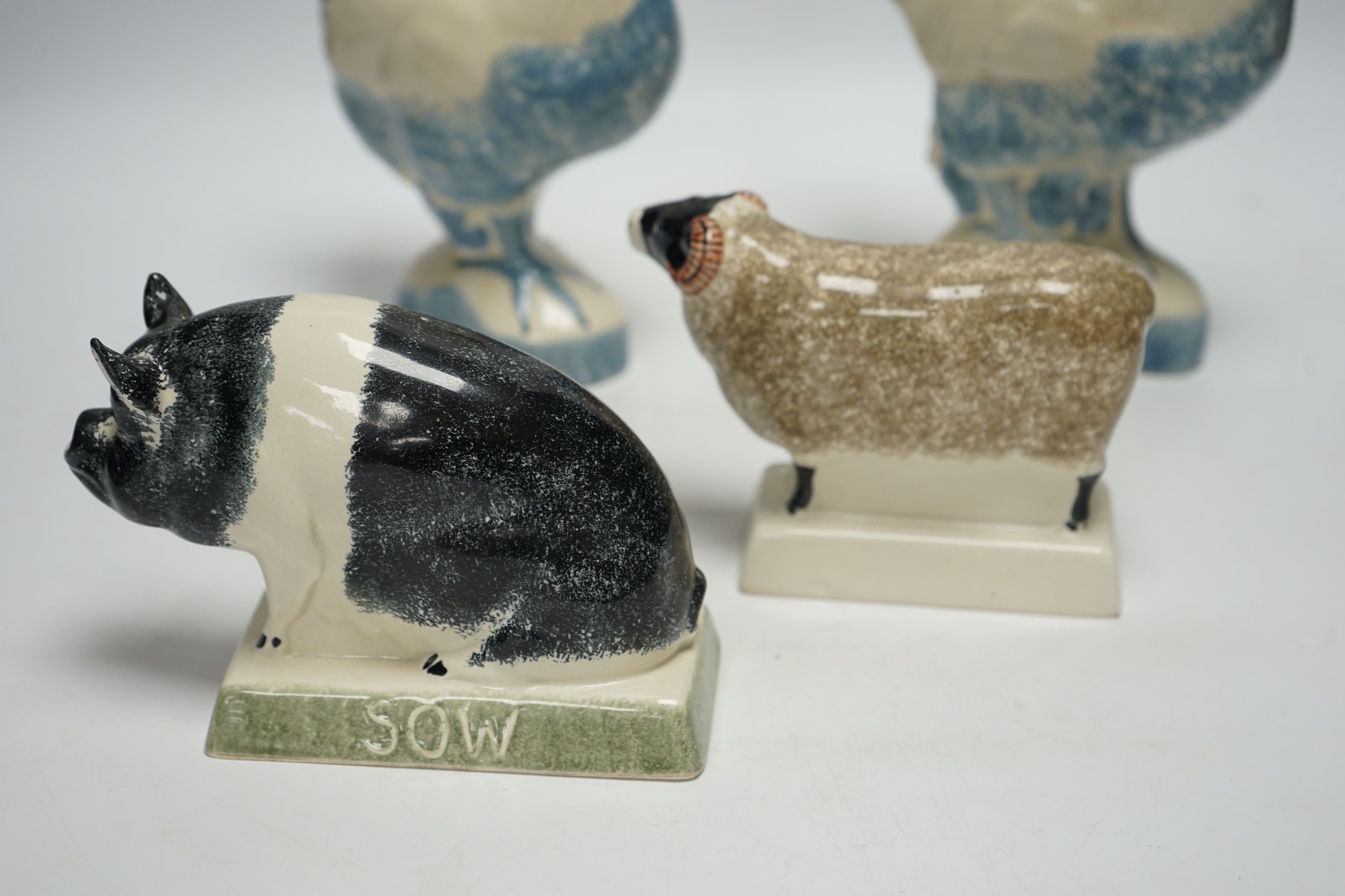 Four pieces of Rye Pottery to include a sow, ram, chicken and cockerel, 22cm